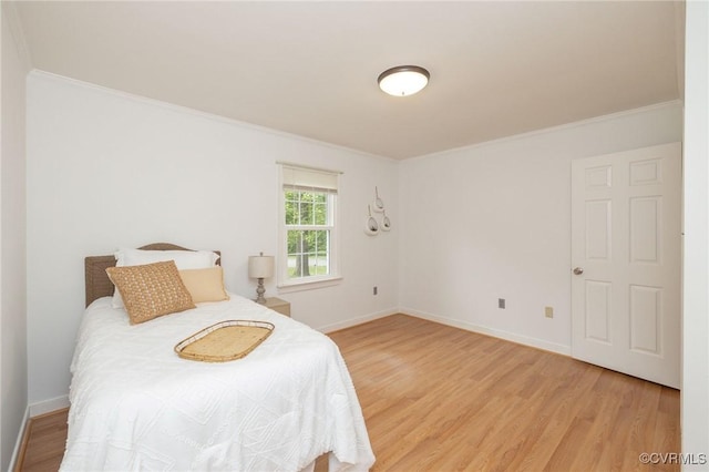 9830 Knobs Hill Ln, Amelia Courthouse, VA 23002 - bedroom featuring light wood-style floors, crown molding, and baseboards