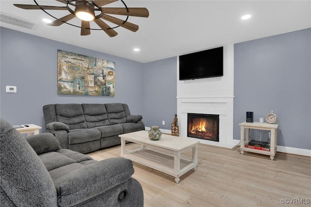 686 Shore Dr, Hartfield, VA 23071 - living room with a ceiling fan, light wood finished floors, a large fireplace, recessed lighting, and baseboards