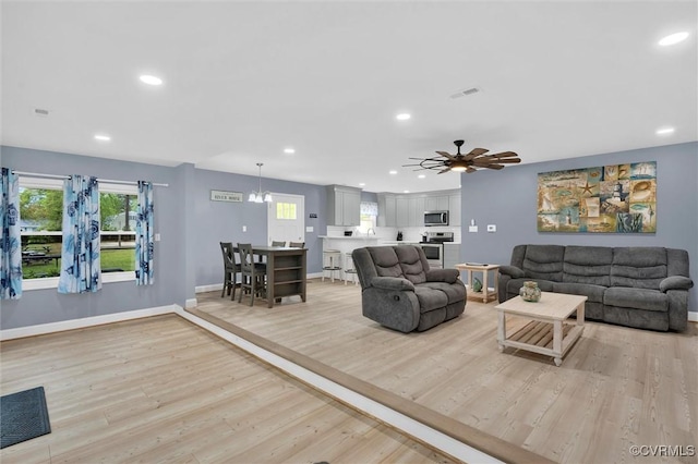 686 Shore Dr, Hartfield, VA 23071 - living area featuring recessed lighting, light wood-type flooring, ceiling fan, and baseboards