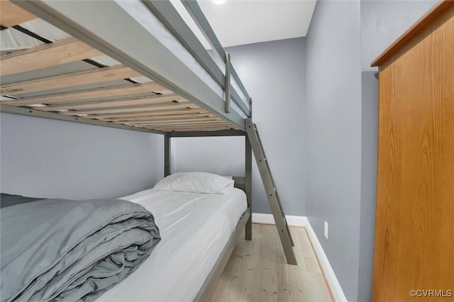 686 Shore Dr, Hartfield, VA 23071 - bedroom with wood finished floors and baseboards