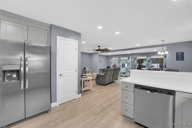 686 Shore Dr, Hartfield, VA 23071 - kitchen with stainless steel appliances, gray cabinets, ceiling fan, light wood-style flooring, and recessed lighting