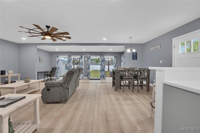 686 Shore Dr, Hartfield, VA 23071 - living room featuring light wood finished floors, recessed lighting, baseboards, and ceiling fan