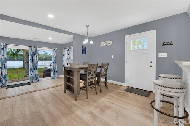 686 Shore Dr, Hartfield, VA 23071 - dining room with light wood-style floors, baseboards, recessed lighting, and a chandelier