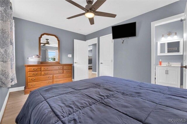 686 Shore Dr, Hartfield, VA 23071 - bedroom featuring wood finished floors, ceiling fan, baseboards, and a sink