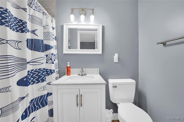 686 Shore Dr, Hartfield, VA 23071 - bathroom featuring toilet, vanity, and a shower with shower curtain