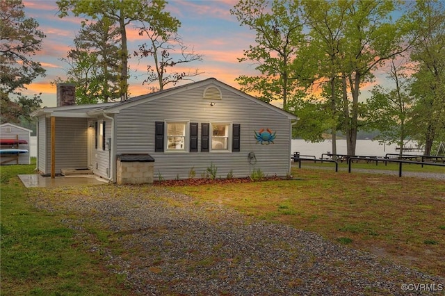 686 Shore Dr, Hartfield, VA 23071 - view of front facade with a chimney