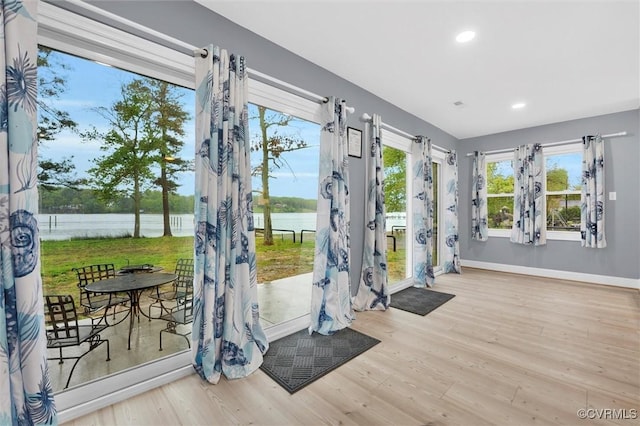 686 Shore Dr, Hartfield, VA 23071 - doorway featuring a water view, baseboards, wood finished floors, and recessed lighting