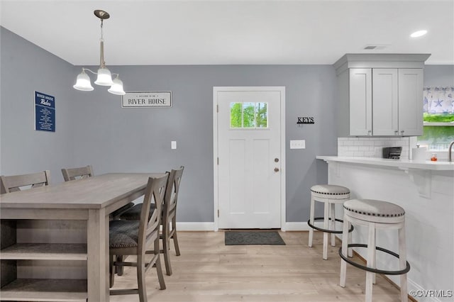 686 Shore Dr, Hartfield, VA 23071 - dining area featuring light wood-style flooring, baseboards, a chandelier, and recessed lighting