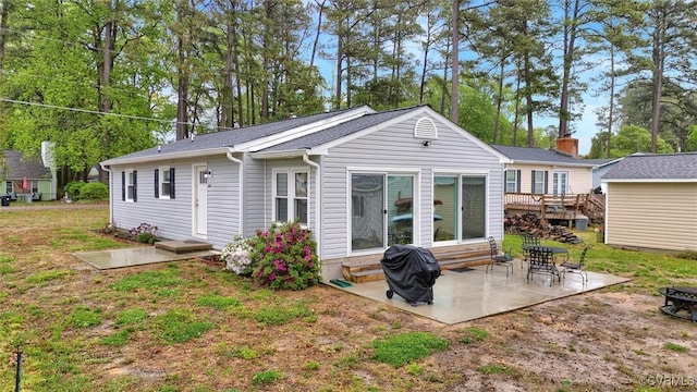 686 Shore Dr, Hartfield, VA 23071 - back of house with entry steps and a patio area