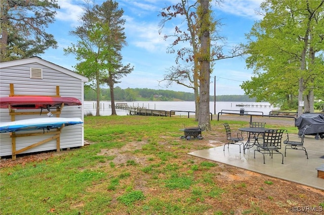 686 Shore Dr, Hartfield, VA 23071 - view of yard featuring a water view, a patio area, and a fire pit