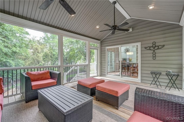 sunroom / solarium featuring ceiling fan, lofted ceiling, and an outdoor living space