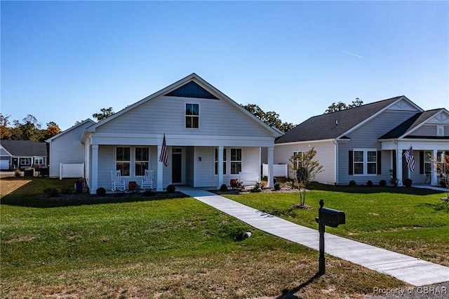926 Old Saint Johns Rd, Irvington, VA 22480 - view of front of property with a porch and a front yard