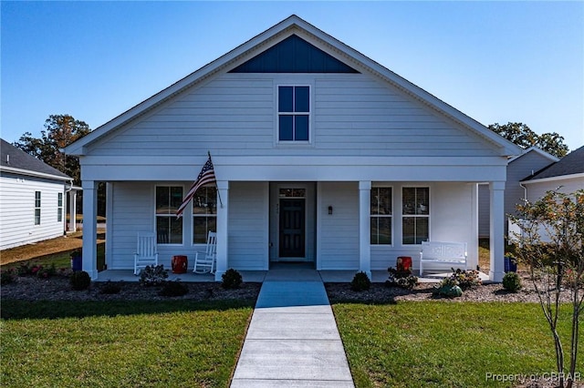 926 Old Saint Johns Rd, Irvington, VA 22480 - bungalow-style house featuring a porch and a front lawn
