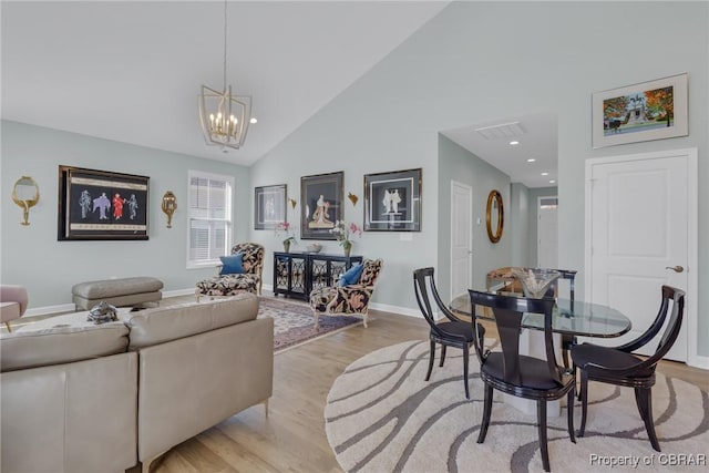 926 Old Saint Johns Rd, Irvington, VA 22480 - living area with a chandelier, light wood-style floors, high vaulted ceiling, baseboards, and recessed lighting