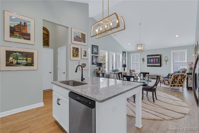 926 Old Saint Johns Rd, Irvington, VA 22480 - kitchen with stainless steel dishwasher, a sink, a chandelier, high vaulted ceiling, and pendant lighting