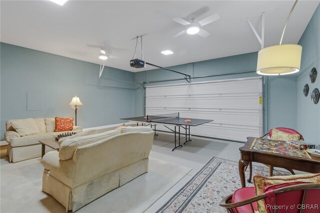 926 Old Saint Johns Rd, Irvington, VA 22480 - rec room featuring a garage, a ceiling fan, and finished concrete floors