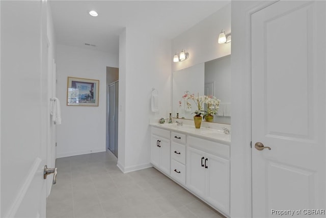 926 Old Saint Johns Rd, Irvington, VA 22480 - full bath featuring a stall shower, double vanity, tile patterned flooring, and baseboards