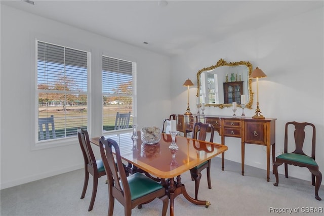 926 Old Saint Johns Rd, Irvington, VA 22480 - carpeted dining space with plenty of natural light and baseboards