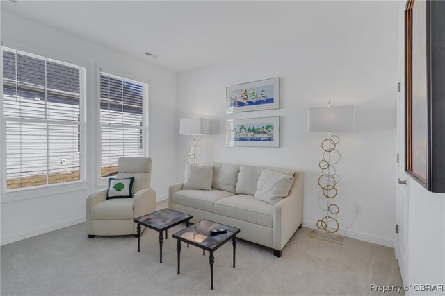 926 Old Saint Johns Rd, Irvington, VA 22480 - living room featuring light colored carpet and baseboards