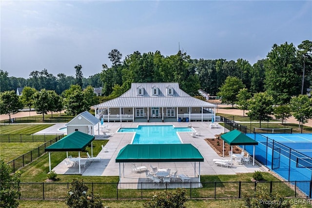 926 Old Saint Johns Rd, Irvington, VA 22480 - back of property featuring a community pool, a patio, a gazebo, and metal roof