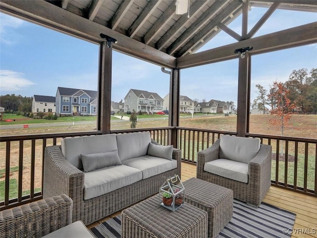 wooden terrace featuring outdoor lounge area and a residential view