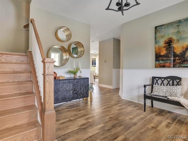 stairs featuring wood finished floors and baseboards