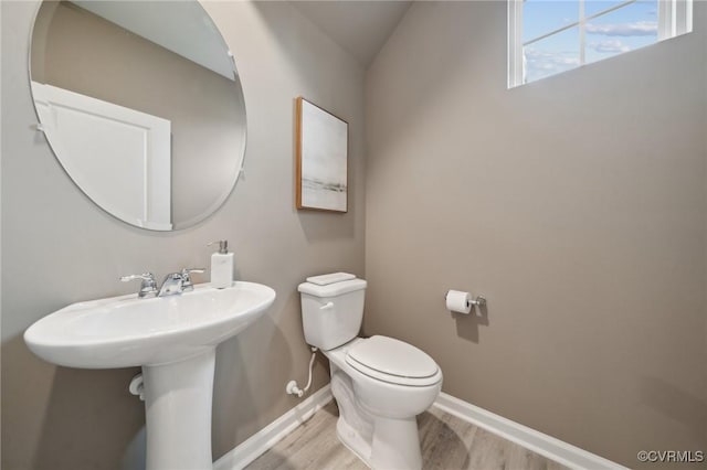 5912 Banyan Ln, Chesterfield, VA 23234 - half bathroom featuring wood finished floors, toilet, baseboards, and a sink