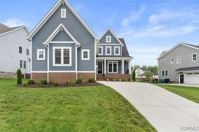 craftsman-style home with board and batten siding, a front yard, and driveway