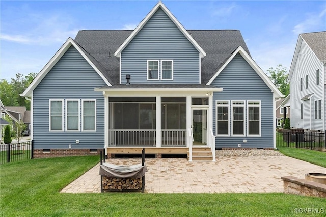 rear view of property featuring crawl space, a patio, a sunroom, and roof with shingles