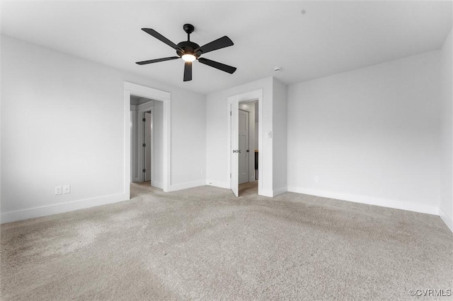 unfurnished bedroom with baseboards, light colored carpet, and ceiling fan