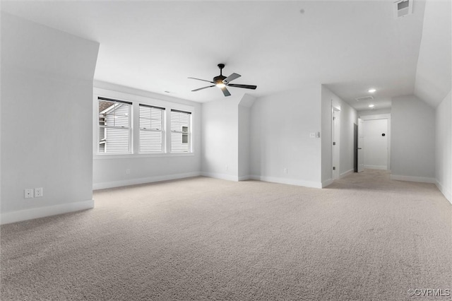 empty room with light carpet, ceiling fan, baseboards, and recessed lighting