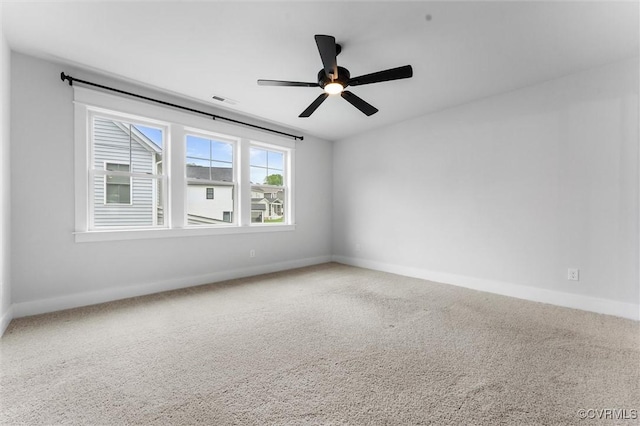 unfurnished room featuring baseboards and carpet flooring