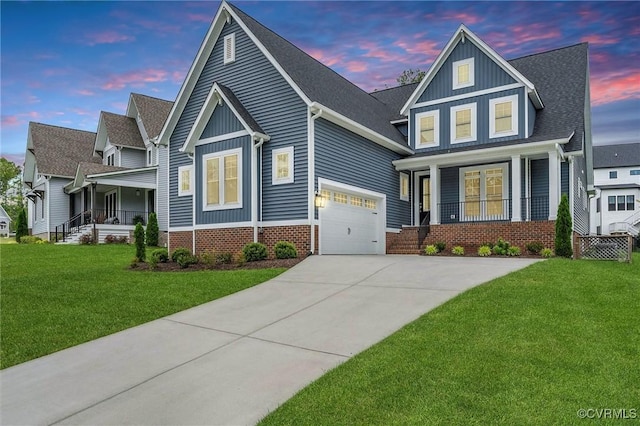 view of front of house featuring a porch, board and batten siding, a yard, and concrete driveway