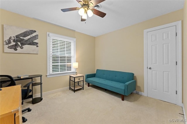 office featuring carpet floors, ceiling fan, and baseboards