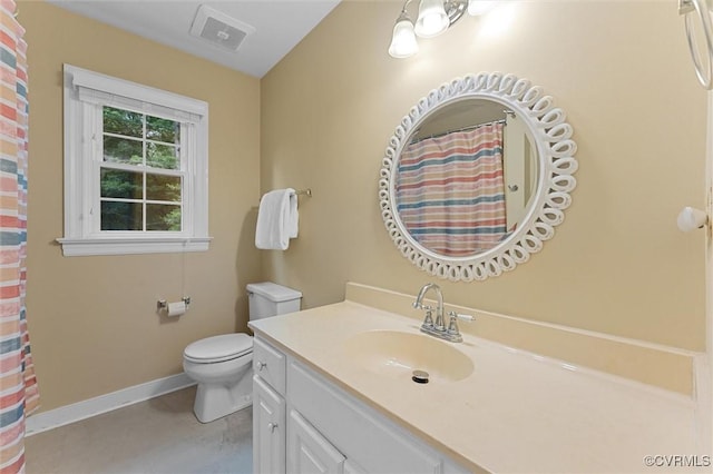 bathroom featuring baseboards, toilet, vanity, and a shower with shower curtain