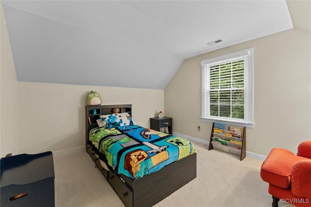bedroom with lofted ceiling, carpet flooring, and baseboards