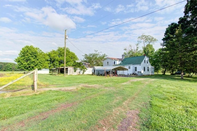 9615 E Quaker Rd, Disputanta, VA 23842 - view of green lawn featuring a carport