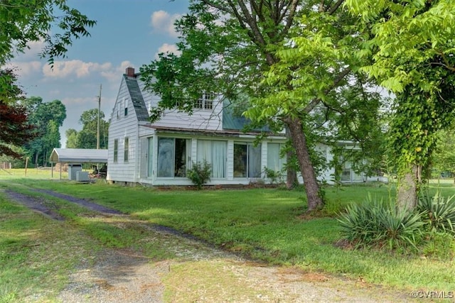 9615 E Quaker Rd, Disputanta, VA 23842 - rear view of property with a chimney and a lawn