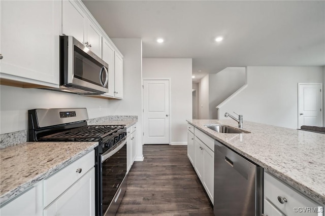 7013 Greenholm Pl, Chesterfield, VA 23234 - kitchen featuring stainless steel appliances, a sink, dark wood-style flooring, white cabinetry, and recessed lighting