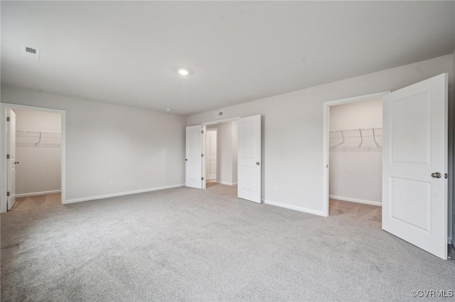 7013 Greenholm Pl, Chesterfield, VA 23234 - unfurnished bedroom with a walk in closet, a closet, carpet floors, and recessed lighting