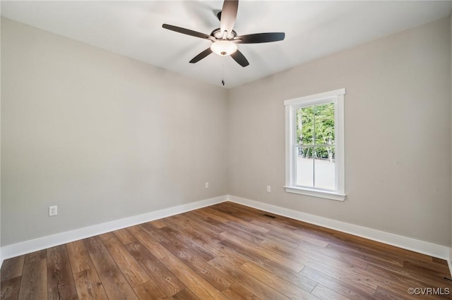 10940 Cross County Rd, Mineral, VA 23117 - spare room with baseboards, hardwood / wood-style floors, and a ceiling fan