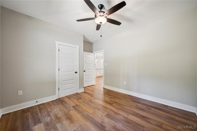 10940 Cross County Rd, Mineral, VA 23117 - unfurnished bedroom with hardwood / wood-style flooring, baseboards, and ceiling fan