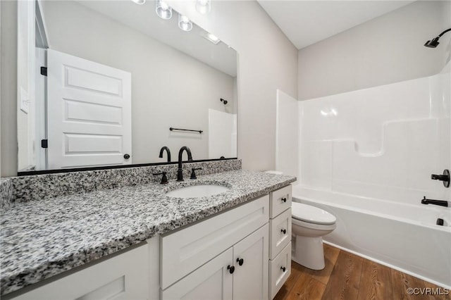 10940 Cross County Rd, Mineral, VA 23117 - full bathroom featuring wood finished floors, toilet, washtub / shower combination, and vanity