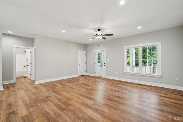 10940 Cross County Rd, Mineral, VA 23117 - unfurnished living room featuring ceiling fan, baseboards, light wood-type flooring, and recessed lighting