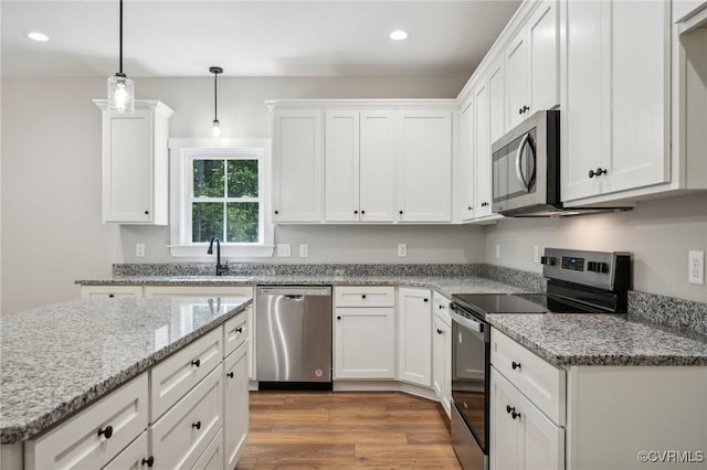 10940 Cross County Rd, Mineral, VA 23117 - kitchen featuring appliances with stainless steel finishes, a sink, white cabinets, and recessed lighting