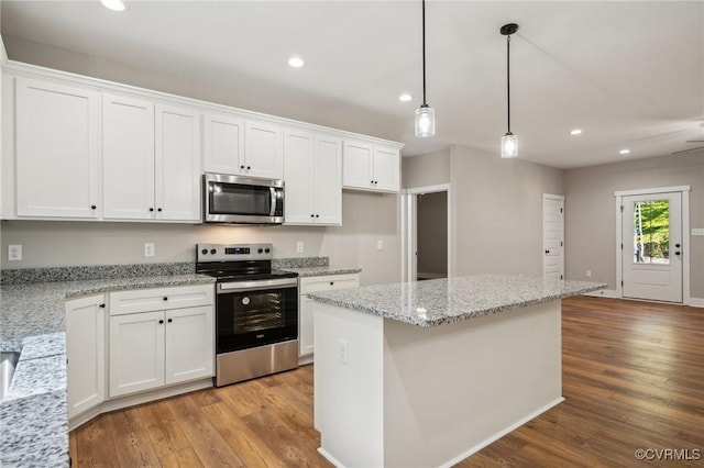 10940 Cross County Rd, Mineral, VA 23117 - kitchen featuring stainless steel appliances, recessed lighting, light wood-style flooring, white cabinetry, and decorative light fixtures