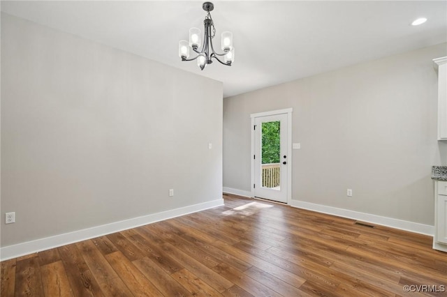 10940 Cross County Rd, Mineral, VA 23117 - unfurnished dining area with a chandelier, hardwood / wood-style floors, baseboards, and recessed lighting