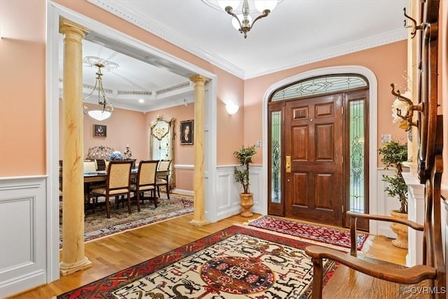 11216 Woodstock Heights Dr, Glen Allen, VA 23059 - foyer entrance with decorative columns, ornamental molding, wood finished floors, and wainscoting