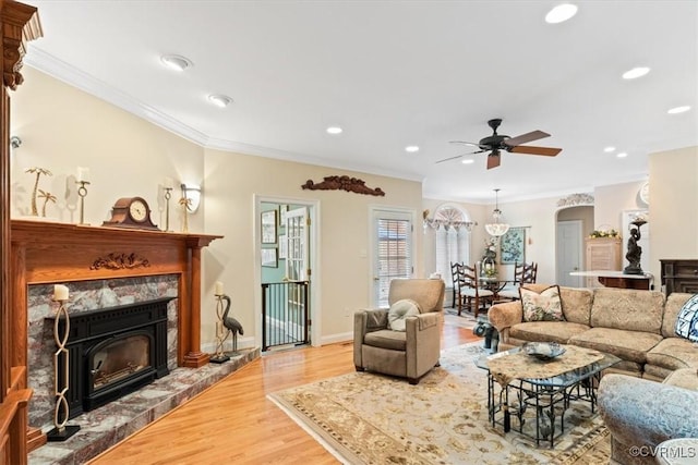 11216 Woodstock Heights Dr, Glen Allen, VA 23059 - living area featuring a ceiling fan, ornamental molding, light wood finished floors, a high end fireplace, and recessed lighting