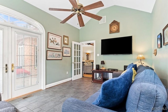 11216 Woodstock Heights Dr, Glen Allen, VA 23059 - living room with french doors, stone tile flooring, baseboards, a ceiling fan, and high vaulted ceiling